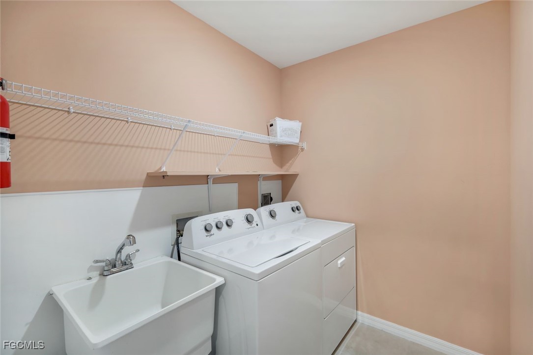 566 Corrientes Circle Punta Gorda, FL 33983 - Photo 25 of 36 a utility room with dryer and washer