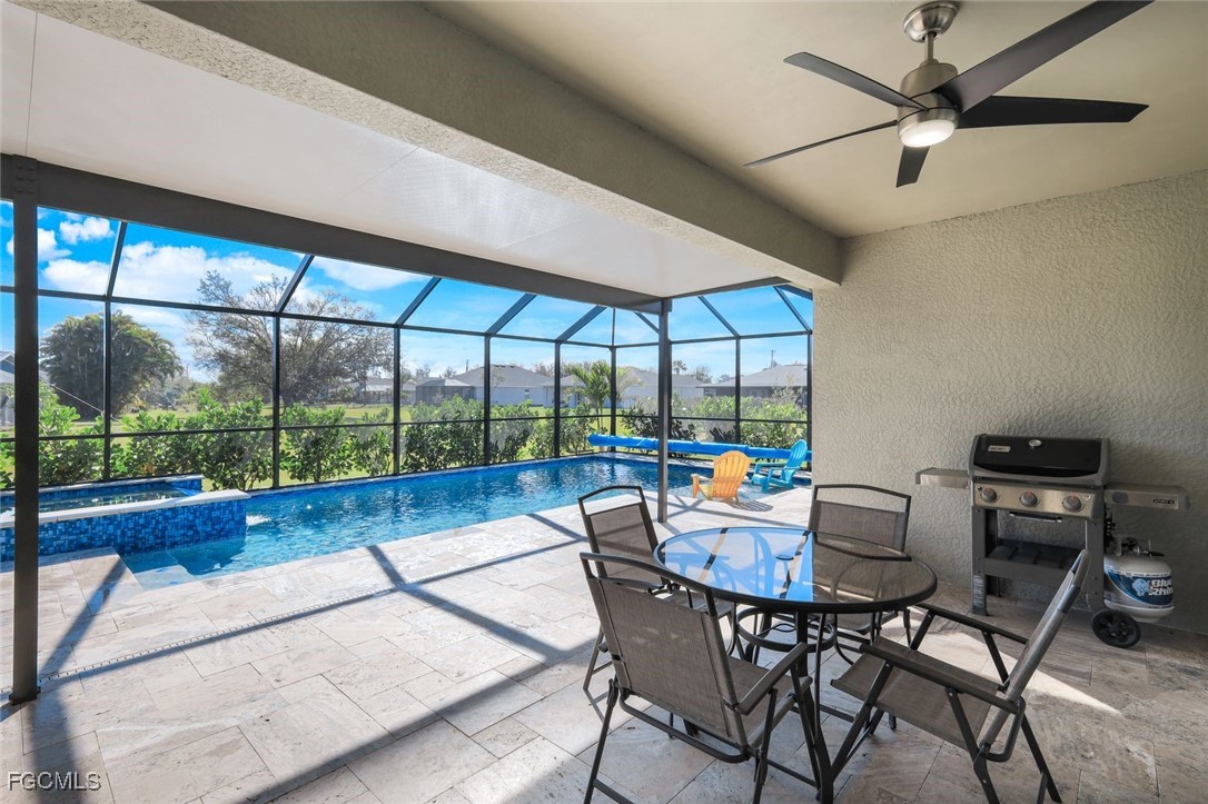 566 Corrientes Circle Punta Gorda, FL 33983 - Photo 26 of 36 a view of a dining room with furniture wooden floor and a chandelier