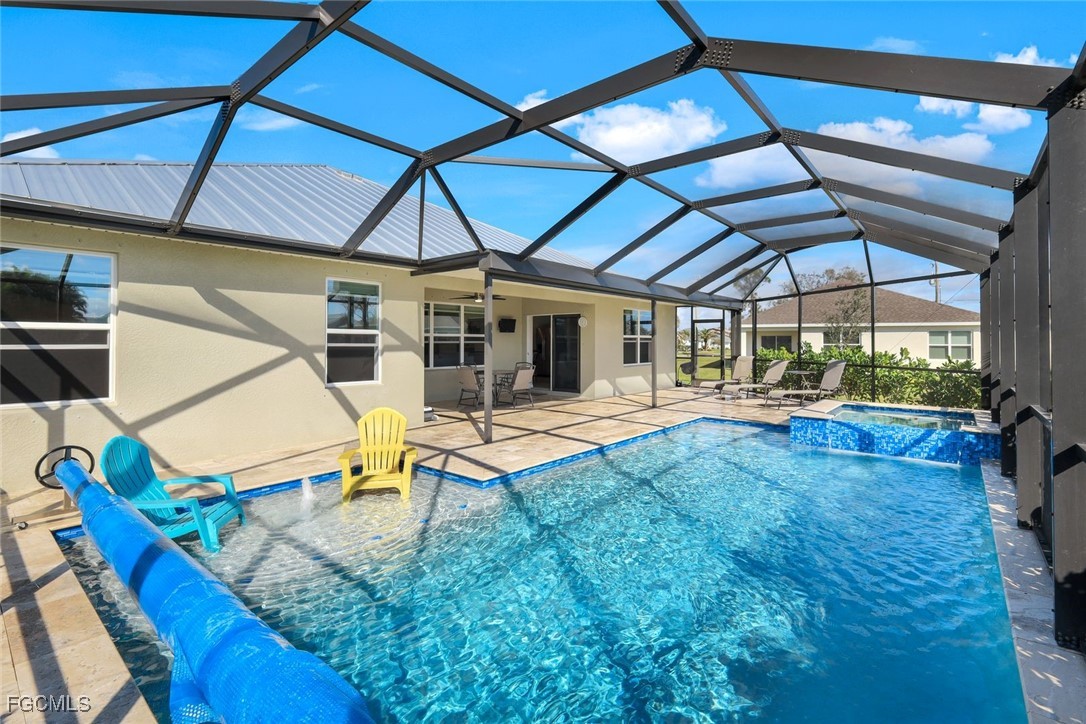 566 Corrientes Circle Punta Gorda, FL 33983 - Photo 29 of 36 a swimming pool with lawn chairs