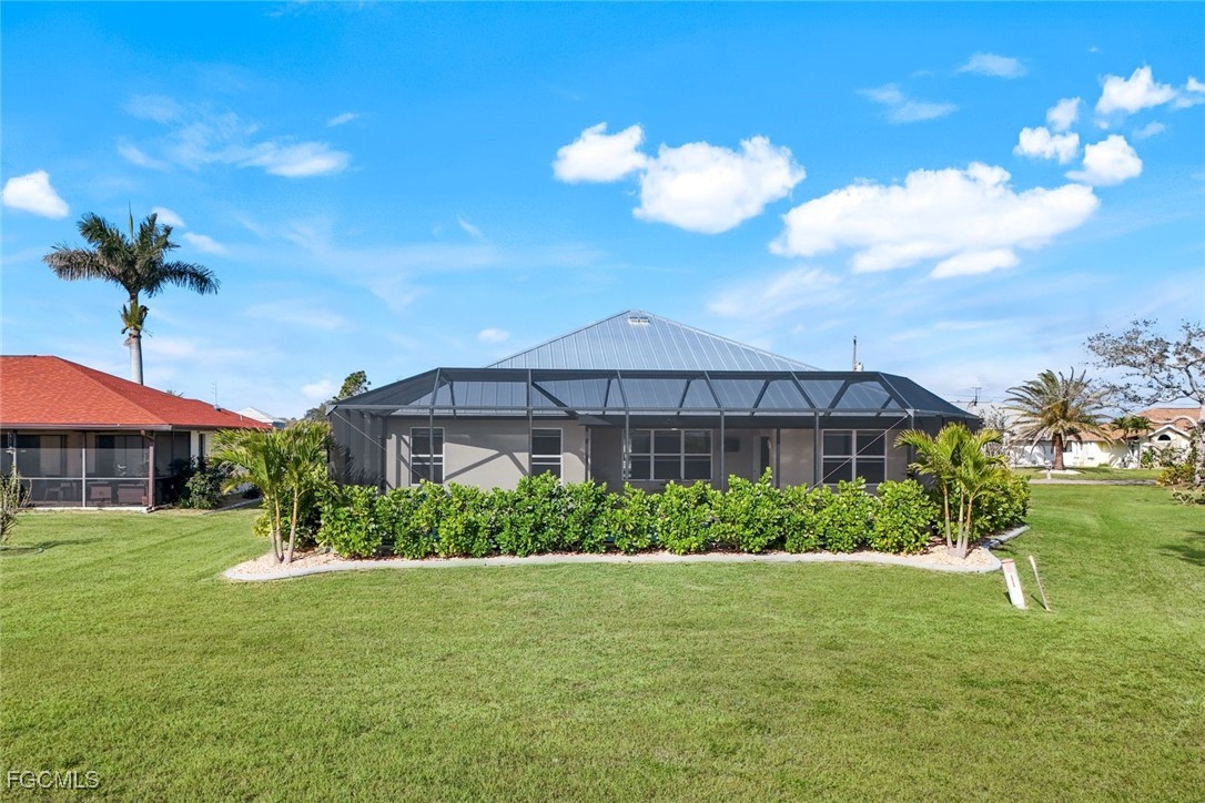 566 Corrientes Circle Punta Gorda, FL 33983 - Photo 32 of 36 a front view of a house with a yard