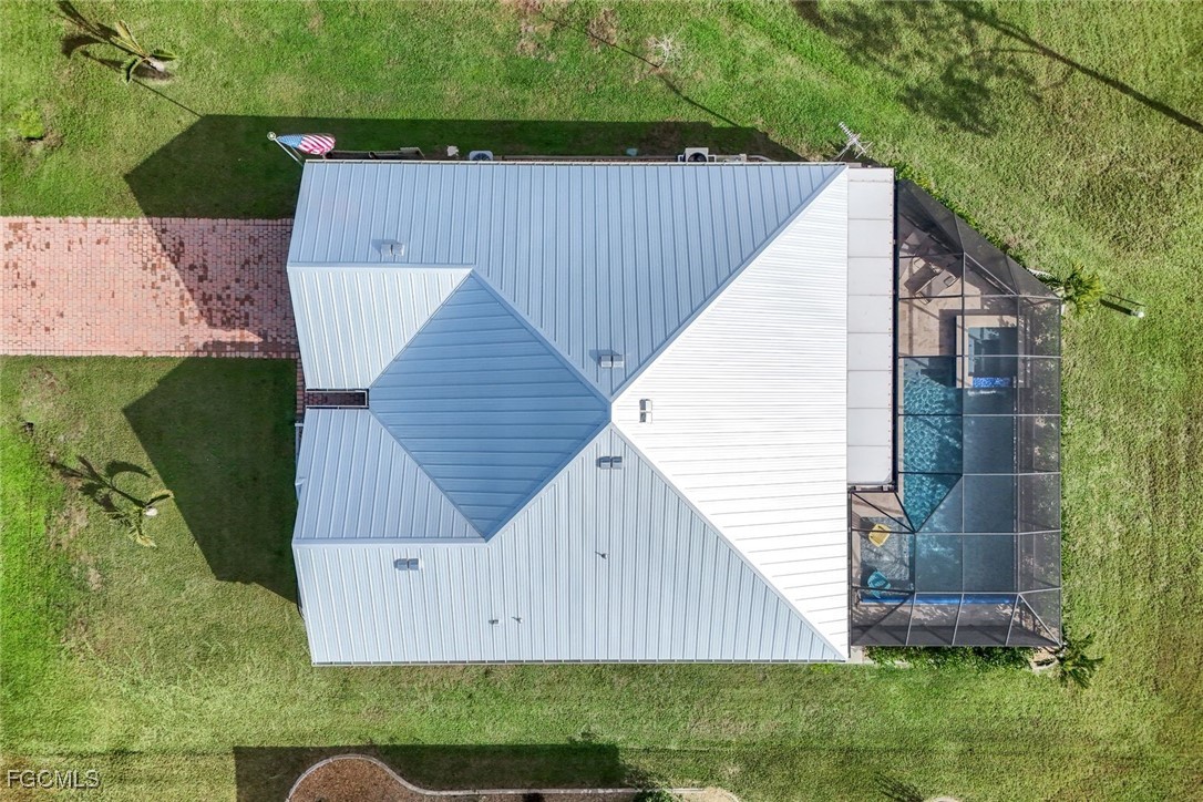 566 Corrientes Circle Punta Gorda, FL 33983 - Photo 36 of 36 a view of backyard with potted plants and a wooden fence