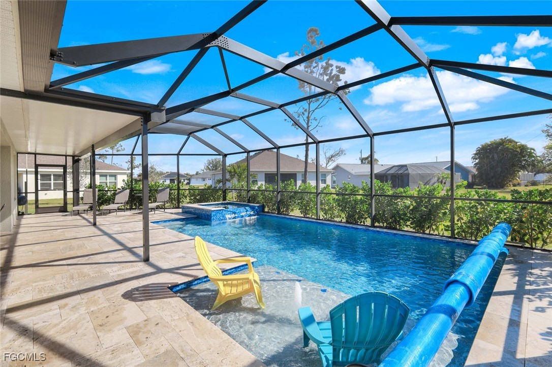 566 Corrientes Circle Punta Gorda, FL 33983 - Photo 4 of 36 a view of a swimming pool with a patio