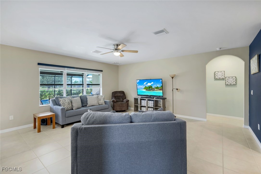 566 Corrientes Circle Punta Gorda, FL 33983 - Photo 10 of 36 a living room with furniture and a flat screen tv