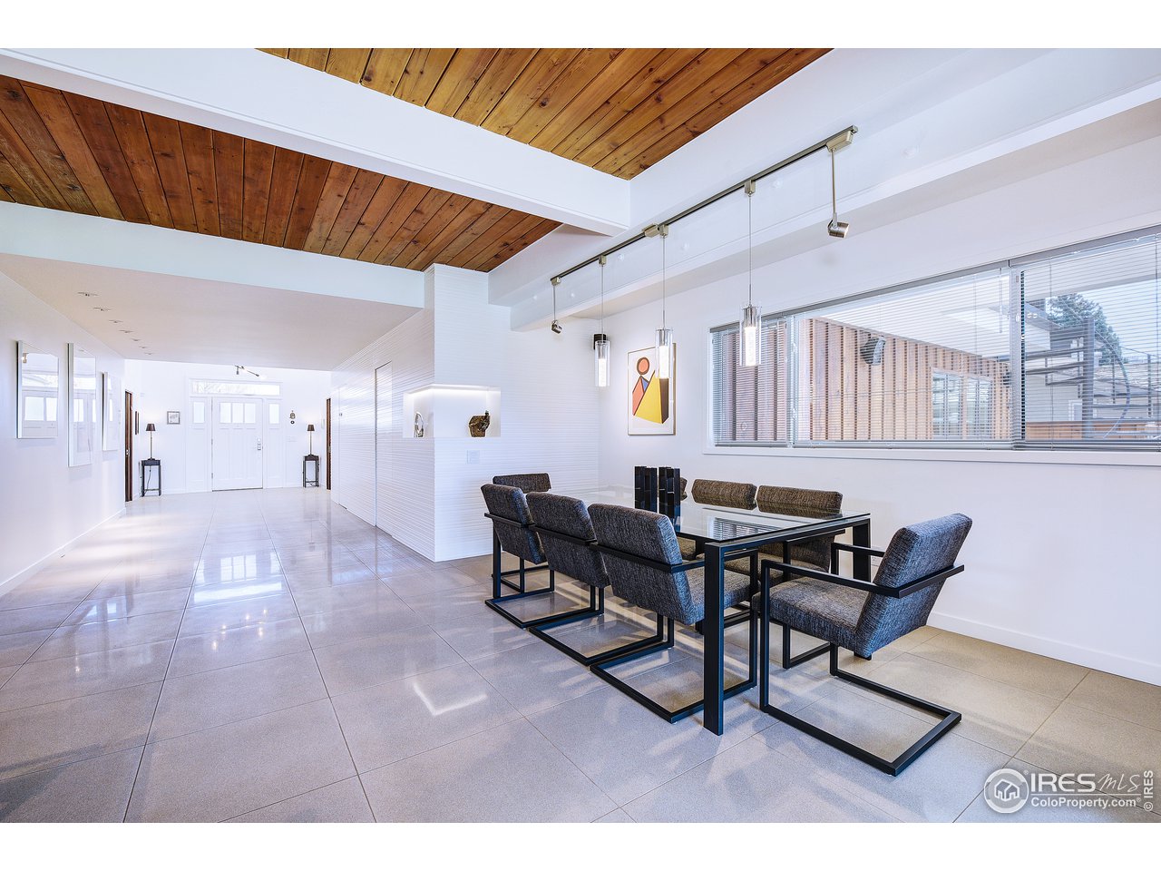 7006 Roaring Fork Trail Boulder, CO 80301 - Photo 13 of 40 a dining room with furniture and wooden floor