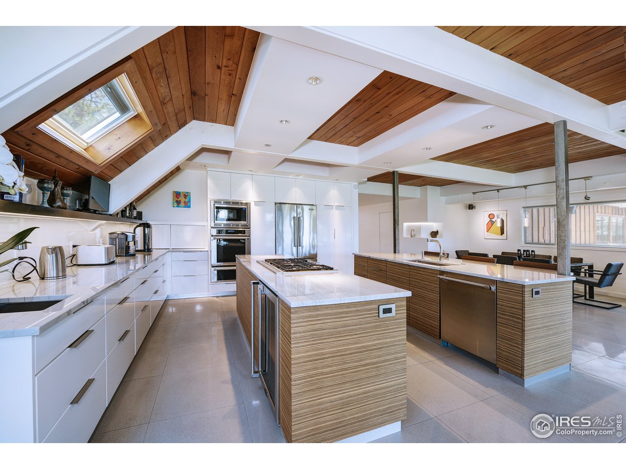 7006 Roaring Fork Trail Boulder, CO 80301 - Photo 17 of 40 a kitchen with stainless steel appliances granite countertop a stove and a refrigerator