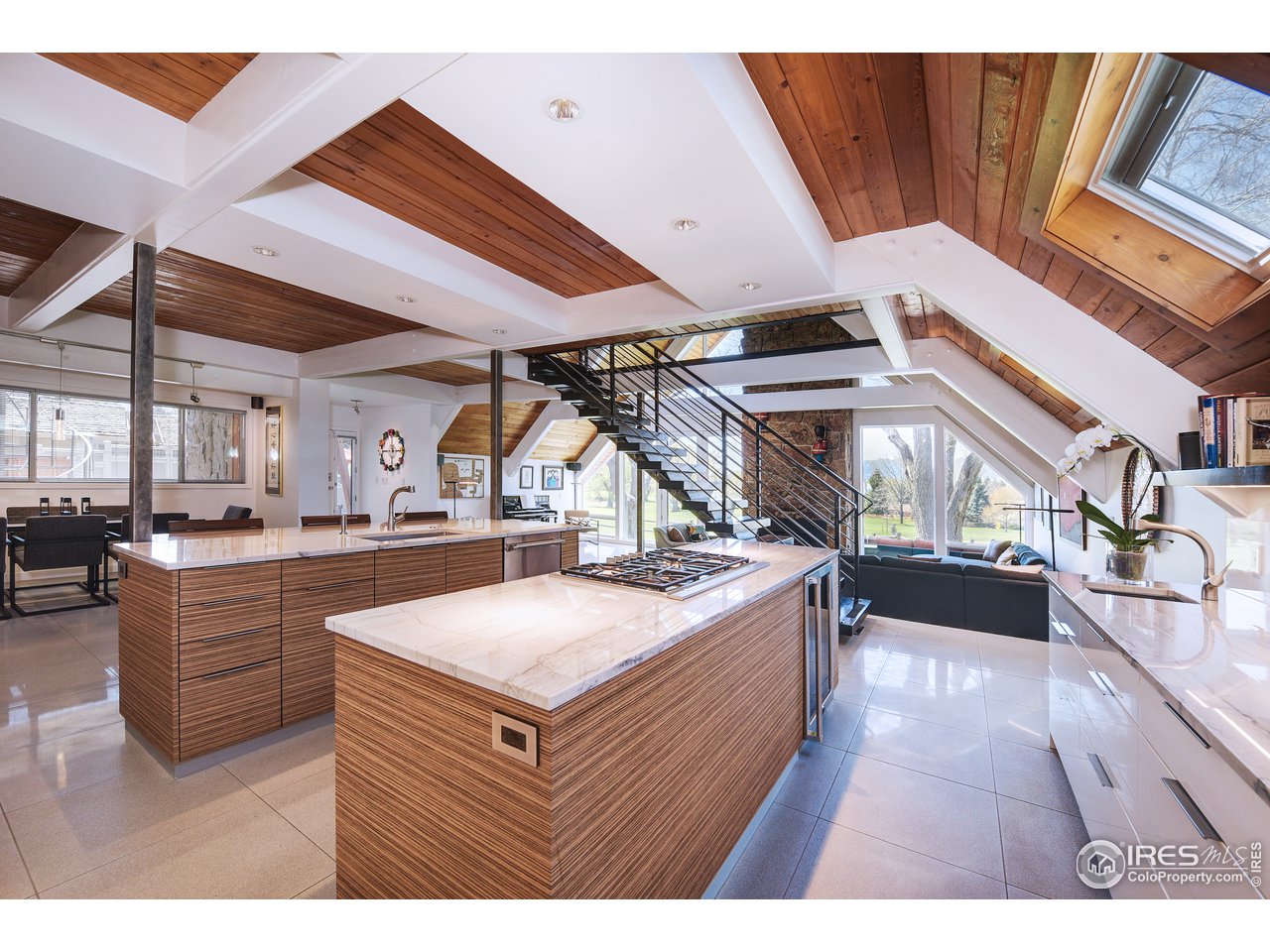 7006 Roaring Fork Trail Boulder, CO 80301 - Photo 18 of 40 a view of living room kitchen with stainless steel appliances wooden floor