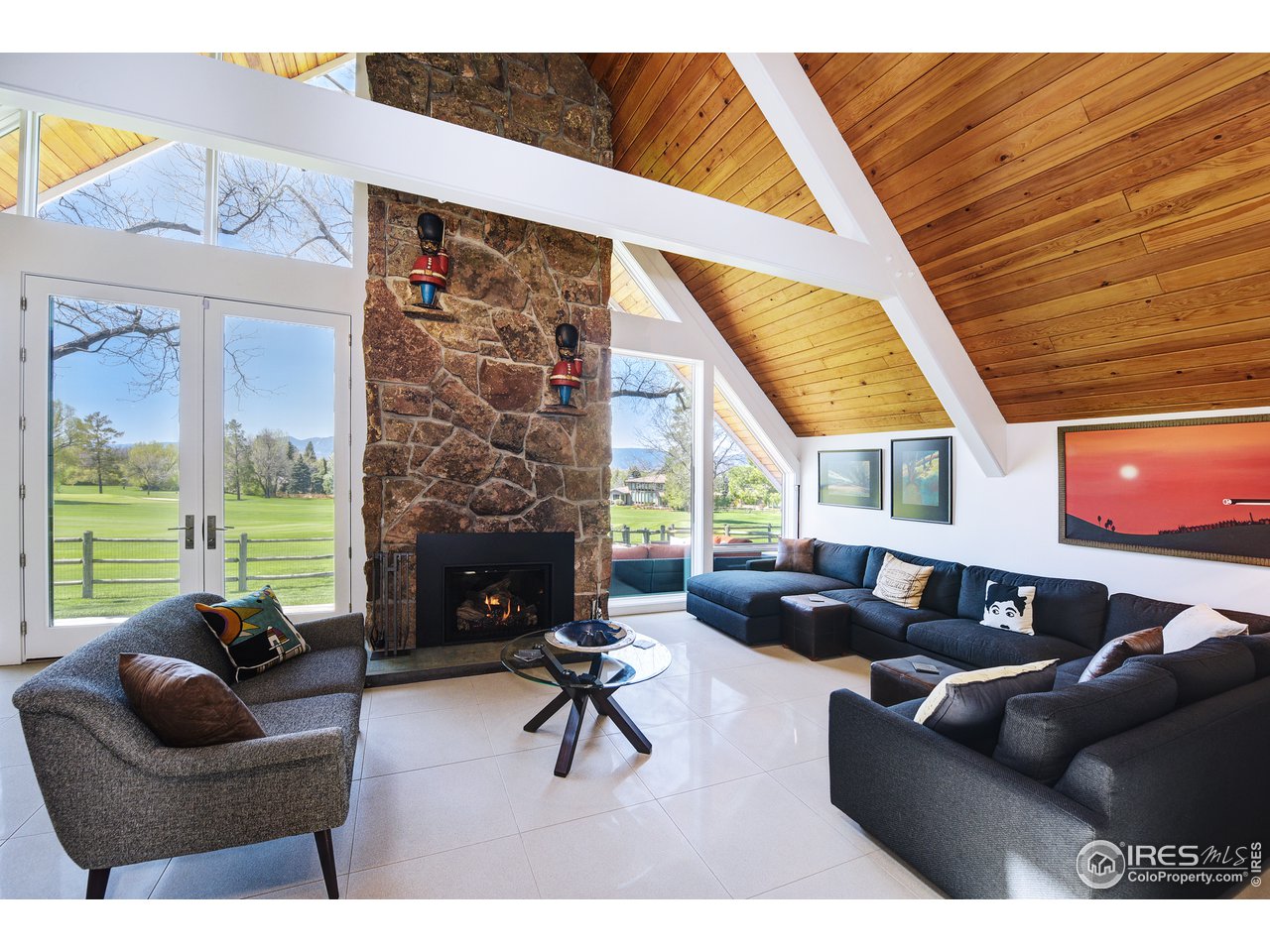 7006 Roaring Fork Trail Boulder, CO 80301 - Photo 20 of 40 a living room with furniture and a large window