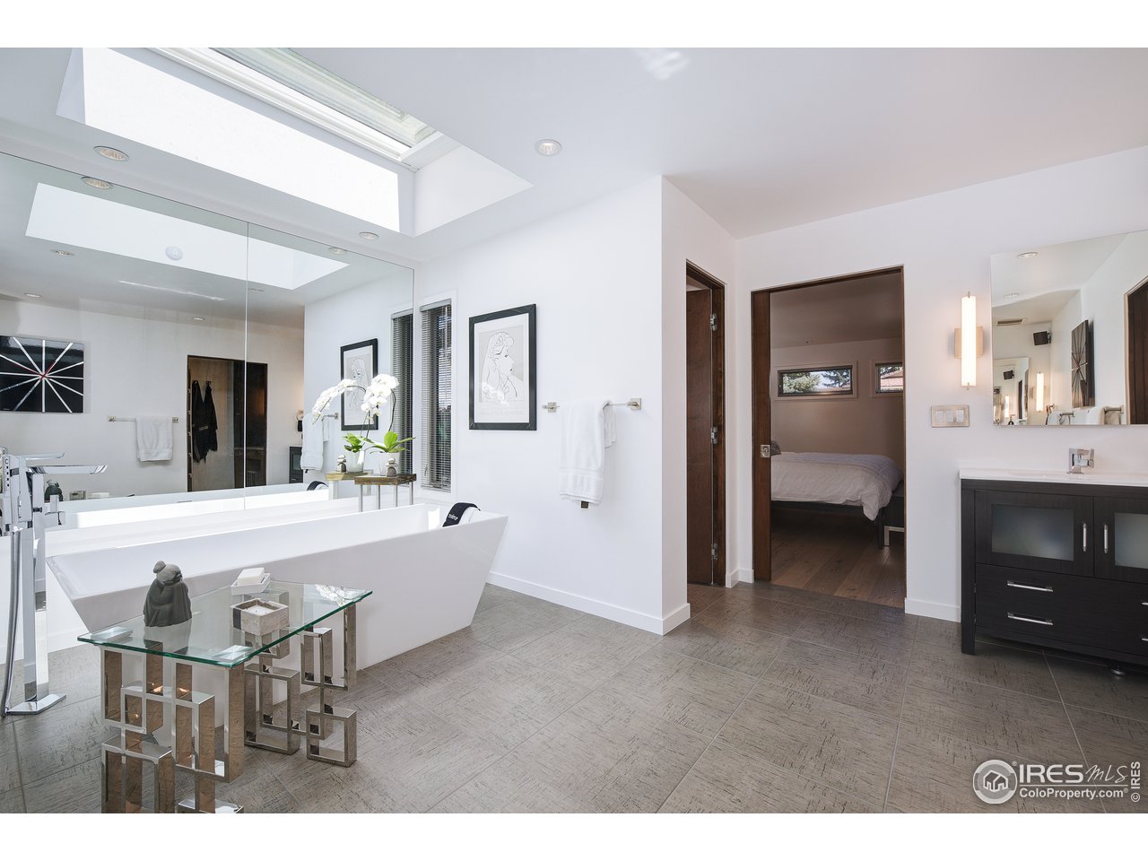 7006 Roaring Fork Trail Boulder, CO 80301 - Photo 26 of 40 a large living room with a fireplace and furniture