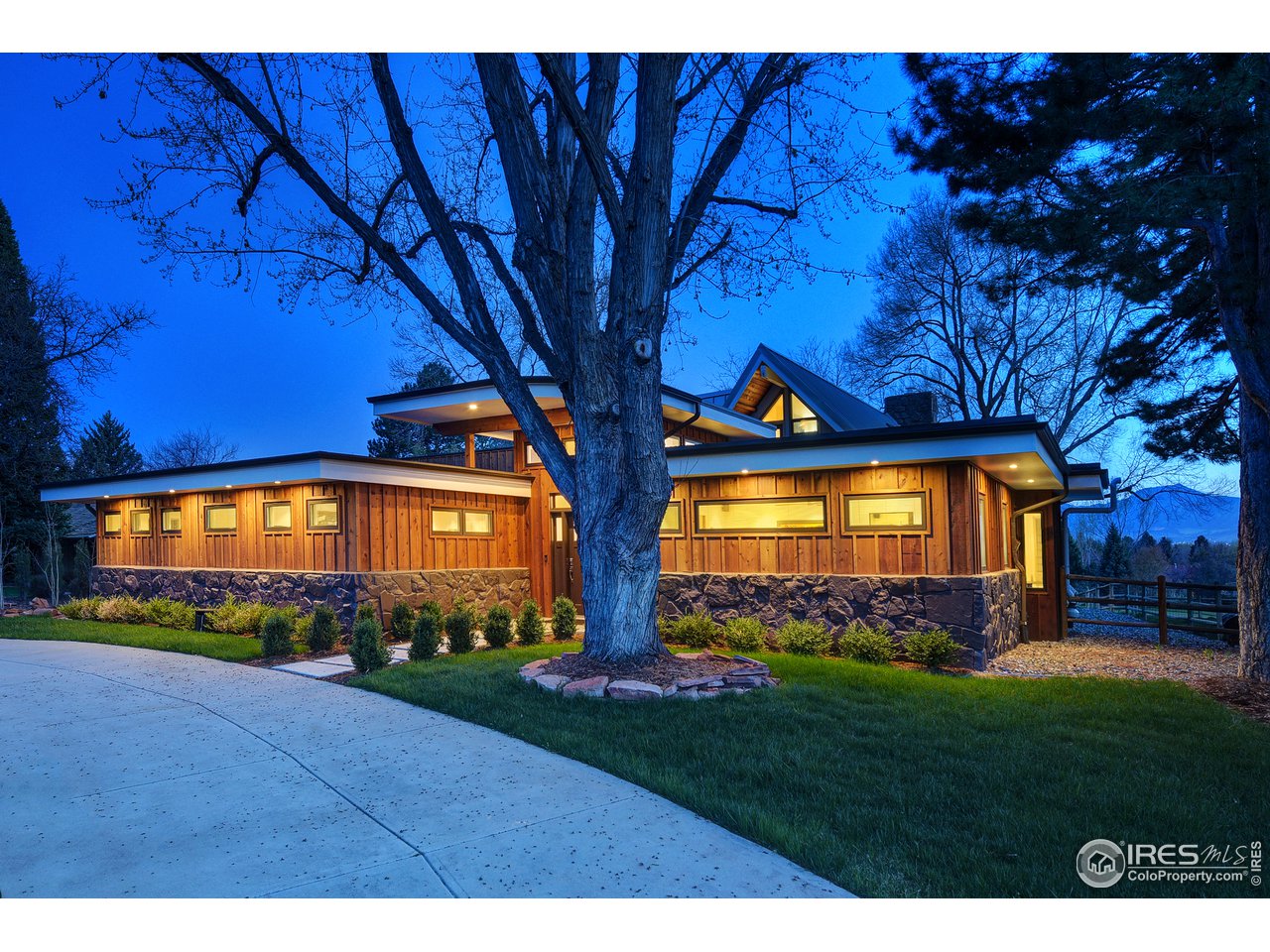 7006 Roaring Fork Trail Boulder, CO 80301 - Photo 3 of 40 a view of a house with a yard
