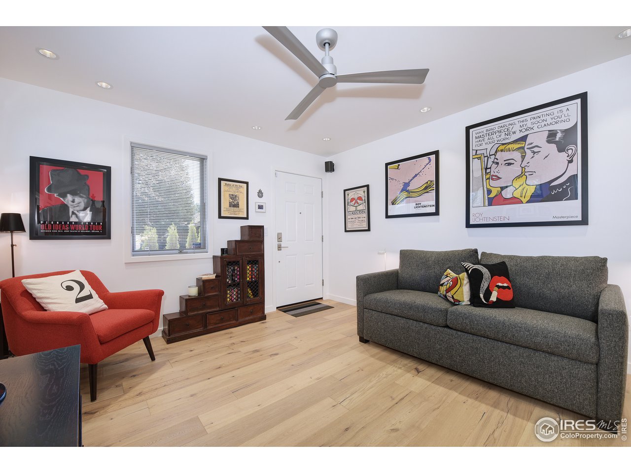 7006 Roaring Fork Trail Boulder, CO 80301 - Photo 31 of 40 a living room with furniture and a flat screen tv with wooden floor