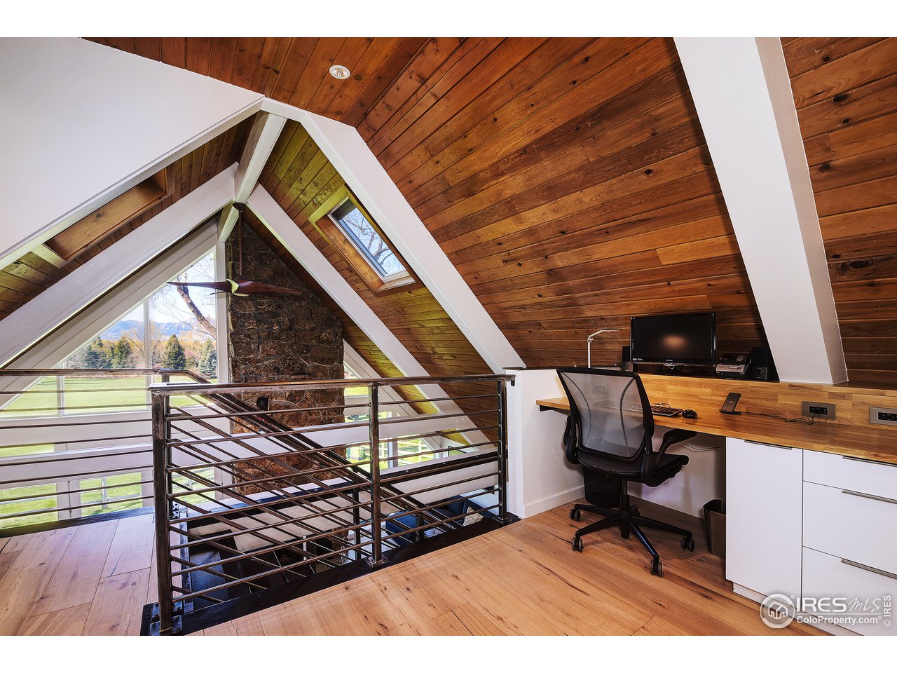7006 Roaring Fork Trail Boulder, CO 80301 - Photo 35 of 40 a view of entryway with wooden floor