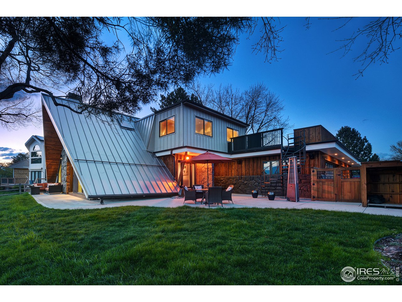 7006 Roaring Fork Trail Boulder, CO 80301 - Photo 6 of 40 a front view of a house with garden