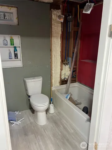 a kitchen with stainless steel appliances a stove a sink and a refrigerator