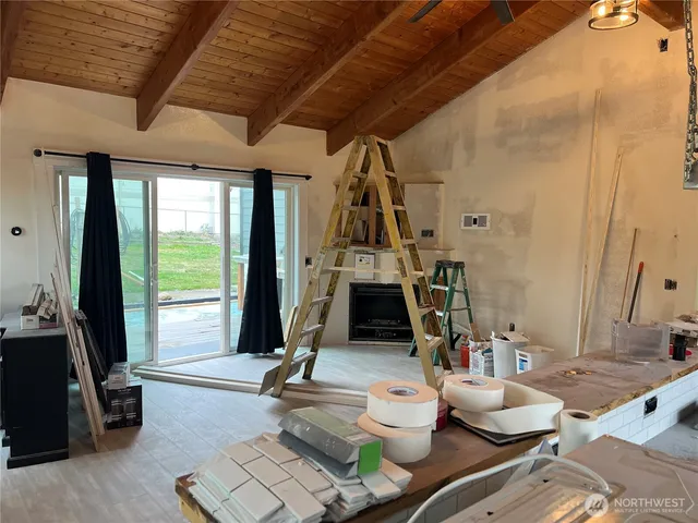 an aerial view of a house with a garden and deck
