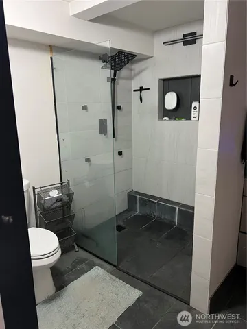 a kitchen with refrigerator and stove