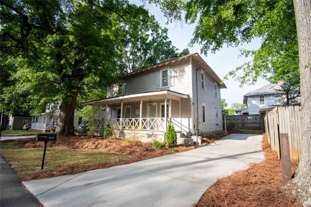702 Radford Street Monroe, GA 30655 - Photo 2 of 49 a front view of a house with a porch