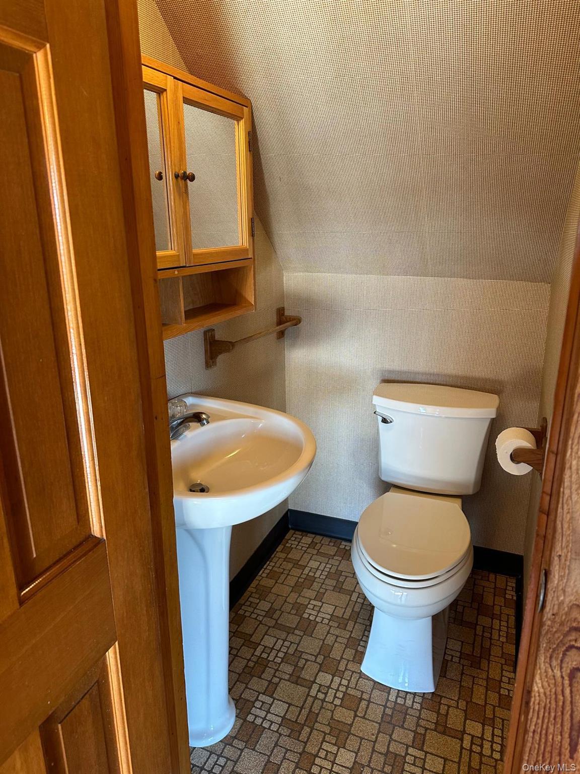 168 Pine Hill Road, Unit 1 Chester, NY 10918 - Photo 5 of 13 Powder room featuring toilet and sink