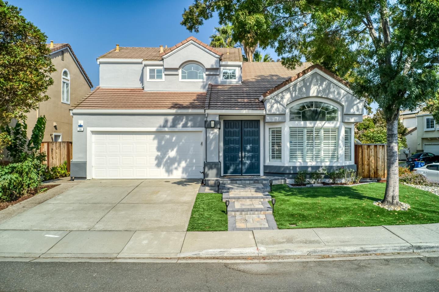 a front view of a house with a yard