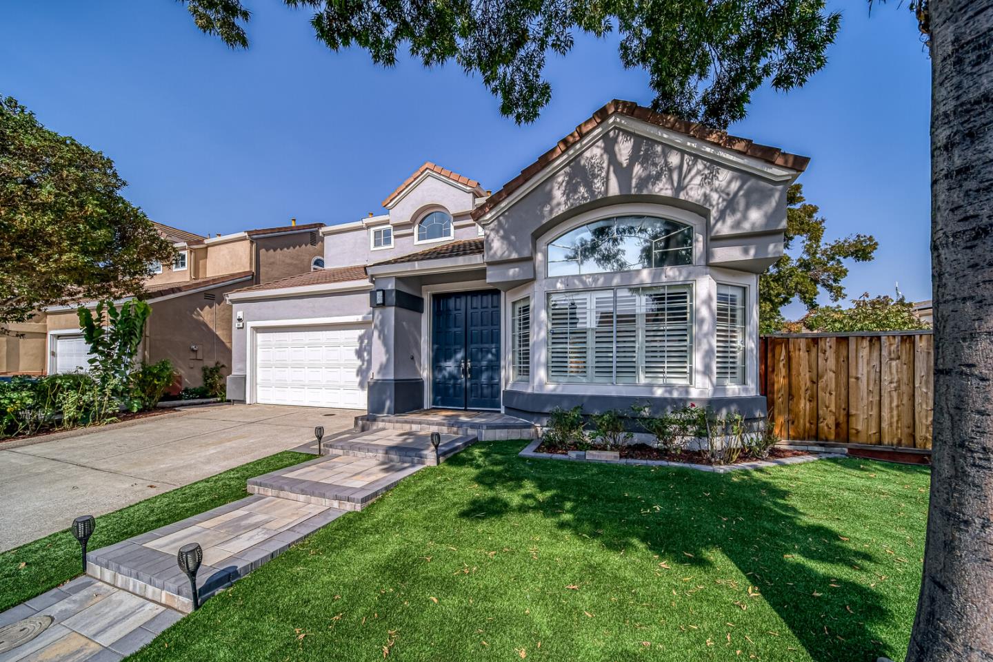 191 Seaside Drive Milpitas, CA 95035 - Photo 2 of 12 a view of house with garden and tall trees