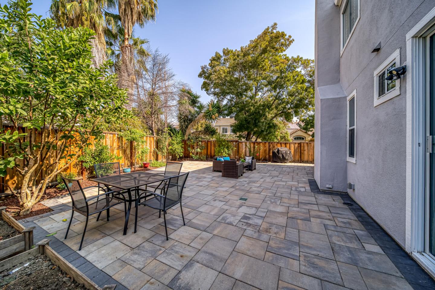 191 Seaside Drive Milpitas, CA 95035 - Photo 6 of 12 a view of a patio with table and chairs and potted plants