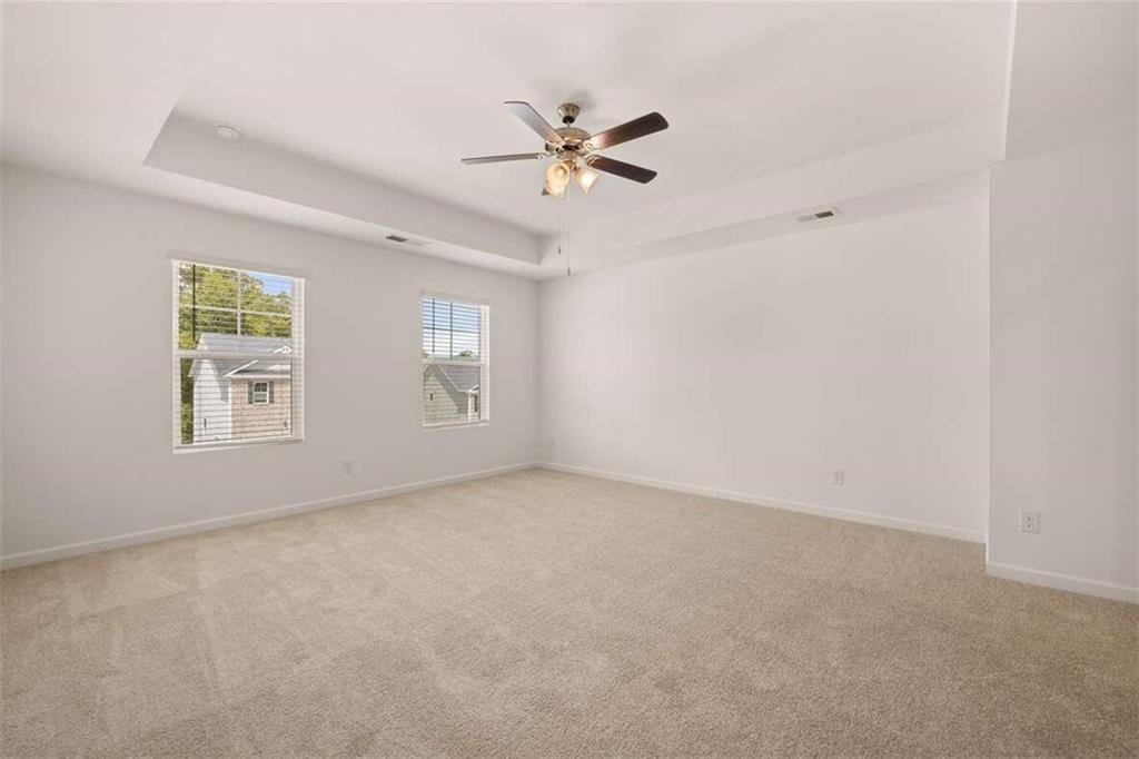 186 Aster Avenue Locust Grove, GA 30248 - Photo 13 of 46 a view of a livingroom with a ceiling fan and window