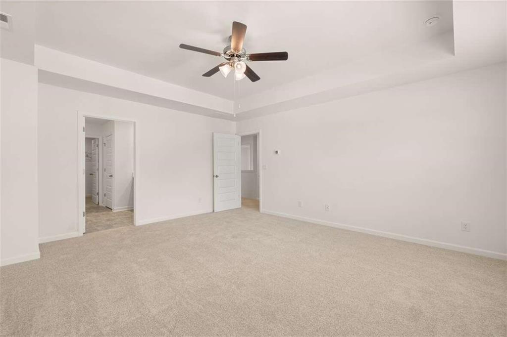 186 Aster Avenue Locust Grove, GA 30248 - Photo 14 of 46 a view of a livingroom with a ceiling fan and window