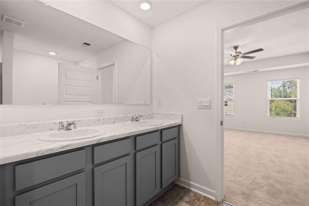 186 Aster Avenue Locust Grove, GA 30248 - Photo 15 of 46 a bathroom with a sink double vanity and a mirror