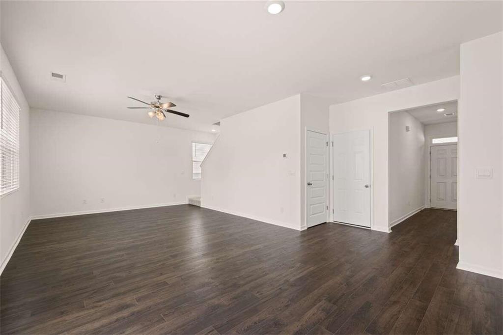 186 Aster Avenue Locust Grove, GA 30248 - Photo 24 of 46 a view of an empty room with wooden floor