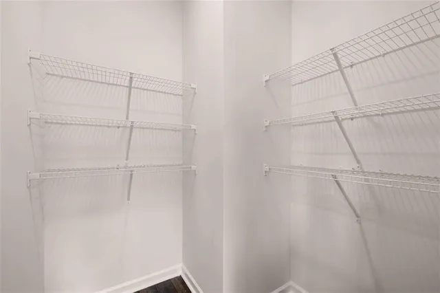 a view of a hallway with white walls