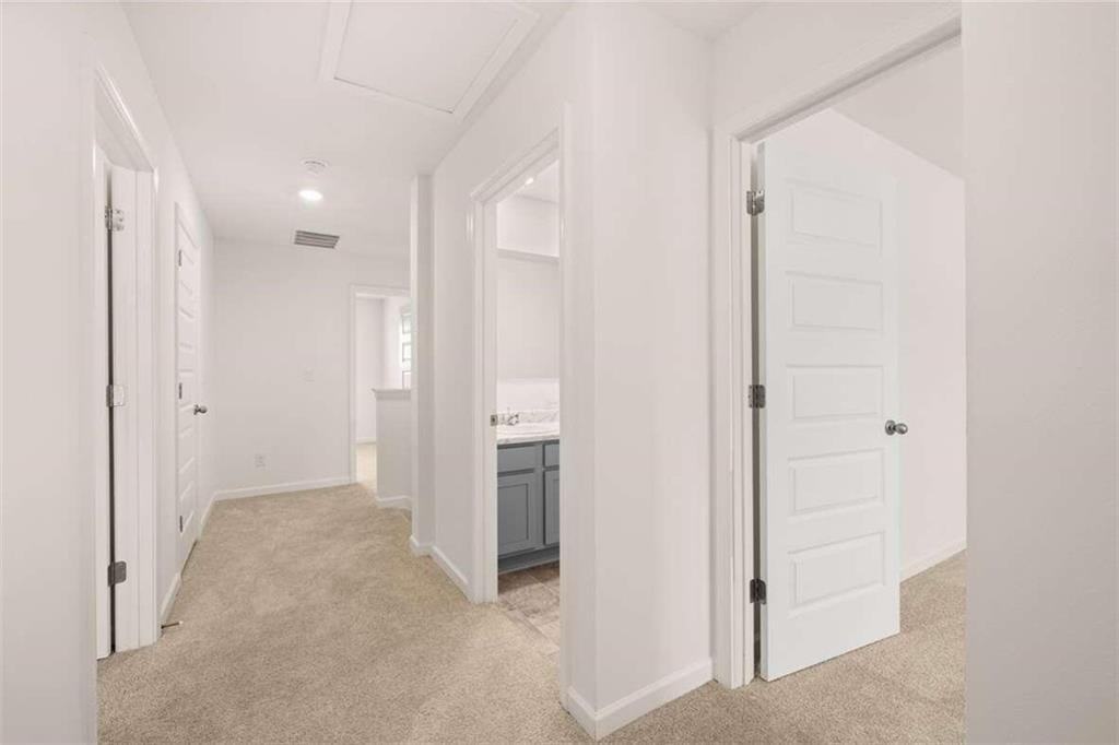 186 Aster Avenue Locust Grove, GA 30248 - Photo 32 of 46 a view of a hallway with an entryway door