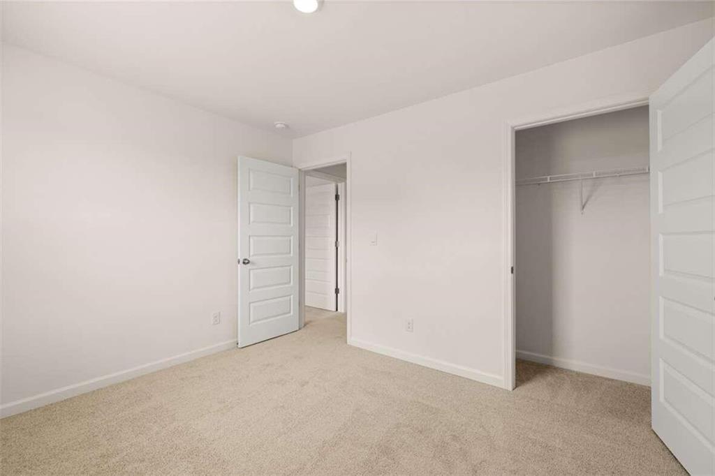 186 Aster Avenue Locust Grove, GA 30248 - Photo 34 of 46 a view of an empty room