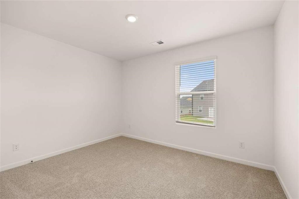 186 Aster Avenue Locust Grove, GA 30248 - Photo 36 of 46 an empty room with a window