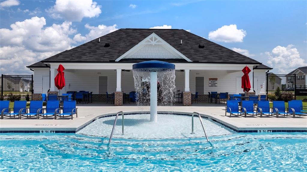186 Aster Avenue Locust Grove, GA 30248 - Photo 4 of 46 a view of a house with entertaining space