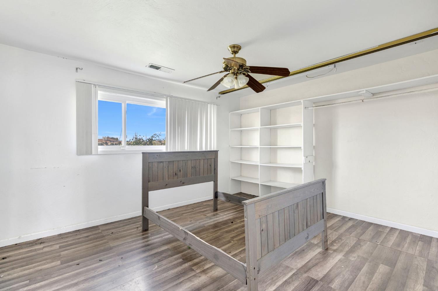 2146 North Maple Avenue Fresno, CA 93703 - Photo 13 of 26 a view of a kitchen with wooden floor and a window