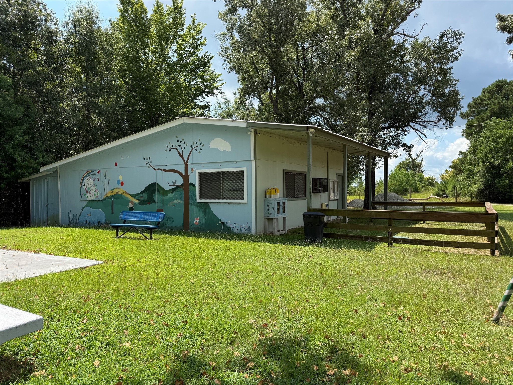 Tbd Buzzard Roost Trail Trinity, TX 75862 - Photo 11 of 18 a front view of house with yard and trees in the background