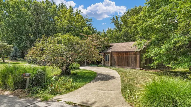 a backyard of a house with lots of green space