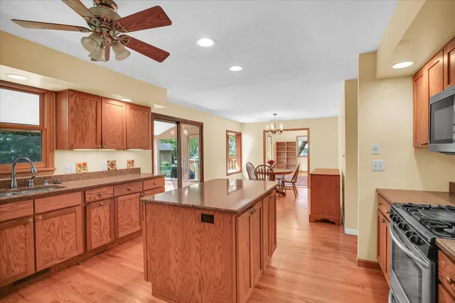 a kitchen with a sink a counter top space and cabinets