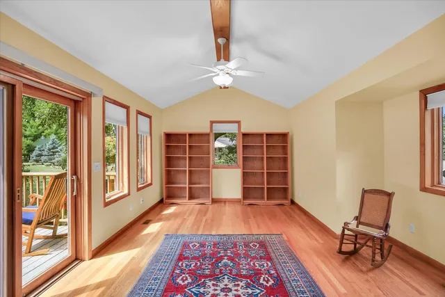 a living room with furniture and a rug