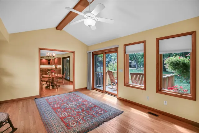 a dining room with furniture and front door