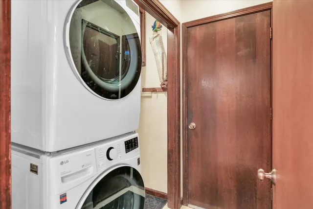 a spacious bedroom with a bed and wooden floor