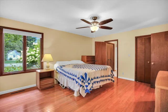 a bedroom with a bed and a dresser