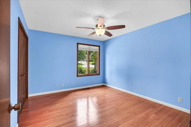 a view of a deck with couches wooden floor and fence