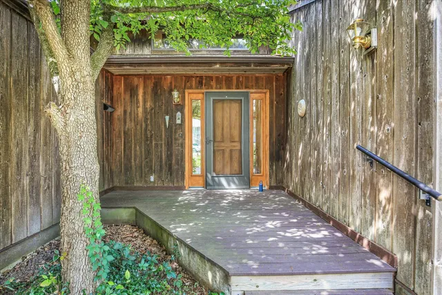 a view of a door with a trees in front of it