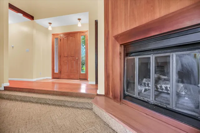 a kitchen with stainless steel appliances granite countertop a sink refrigerator and cabinets