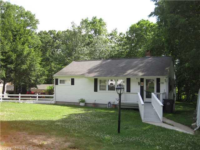 59 Chappell Street Chaplin, CT 06235 - Photo 1 of 1 a front view of a house with a yard