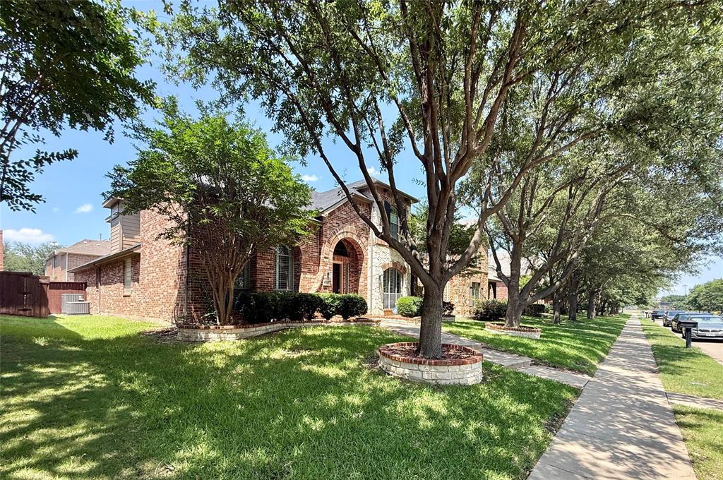 2754 Ridge View Road Frisco, TX 75034 - Photo 3 of 34 a front view of a house with a yard and tree