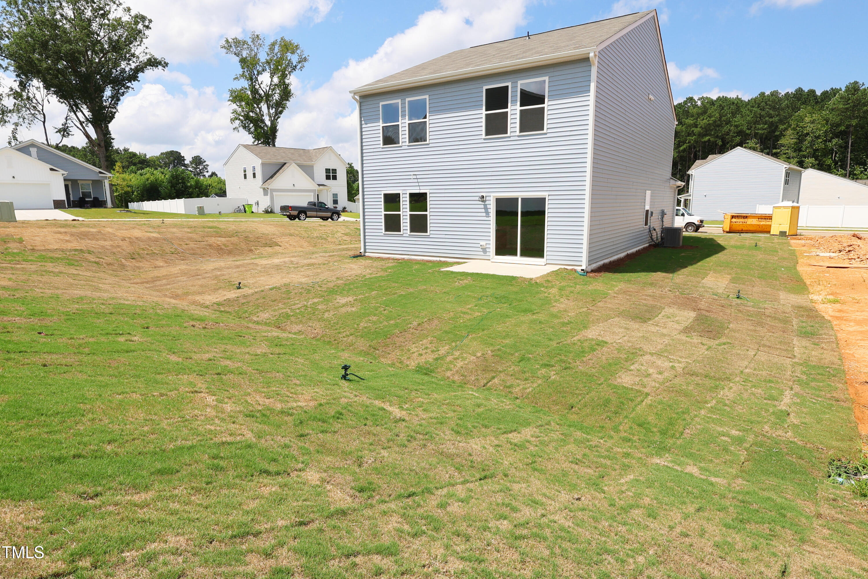 915 Dassault Ln Spring Spring Hope, NC 27882 - Photo 7 of 26 a backyard of a house with table and chairs