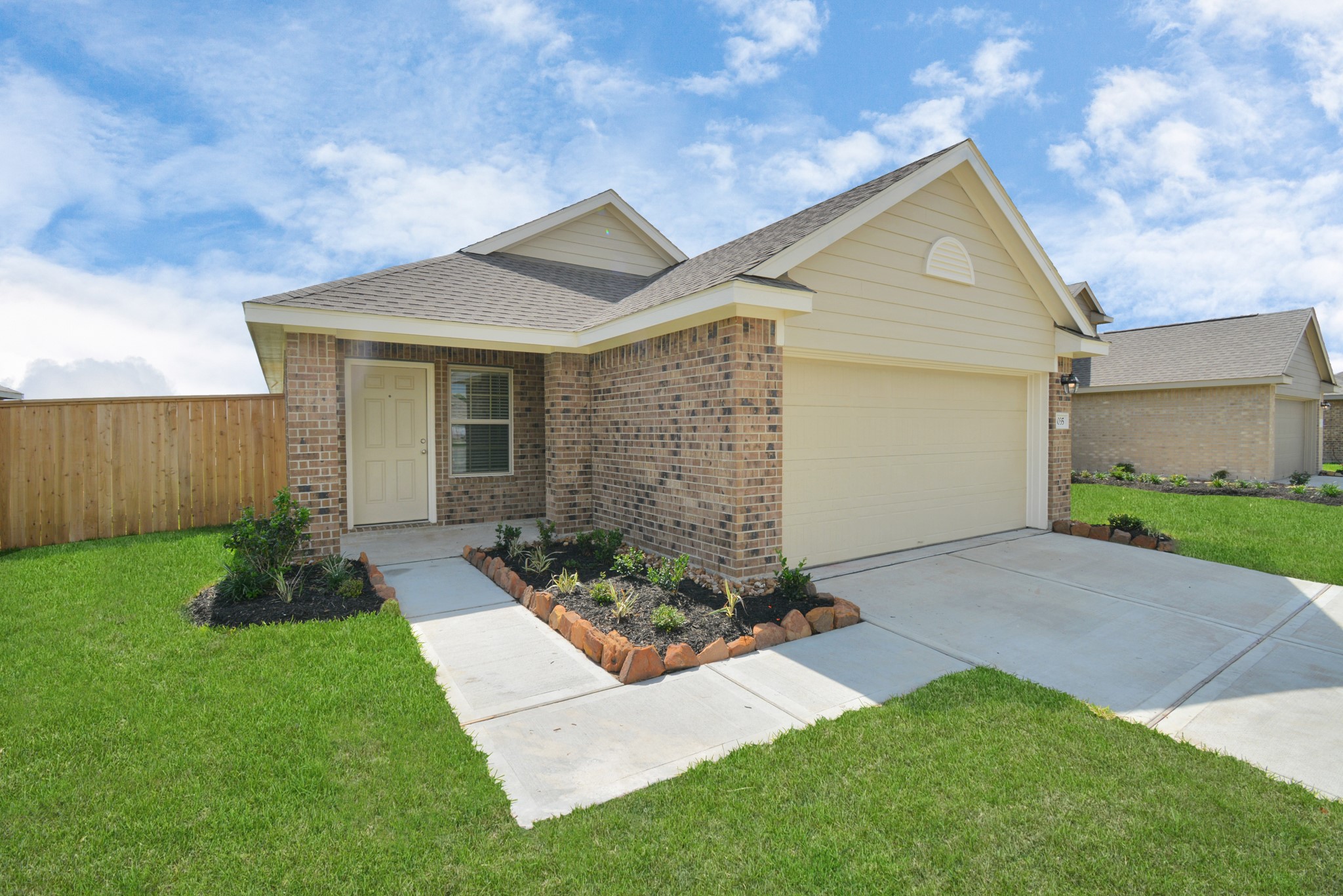 5035 Caledonia Lake Lane Rosharon, TX 77583 - Photo 1 of 37 a front view of a house with a yard and garage