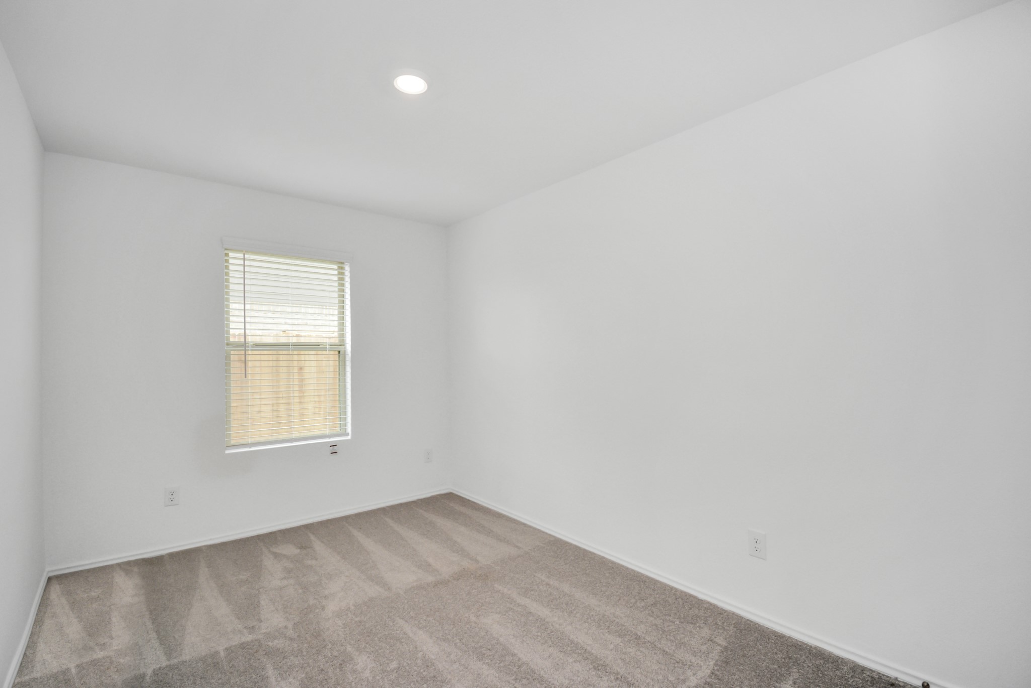5035 Caledonia Lake Lane Rosharon, TX 77583 - Photo 14 of 37 an empty room with a window