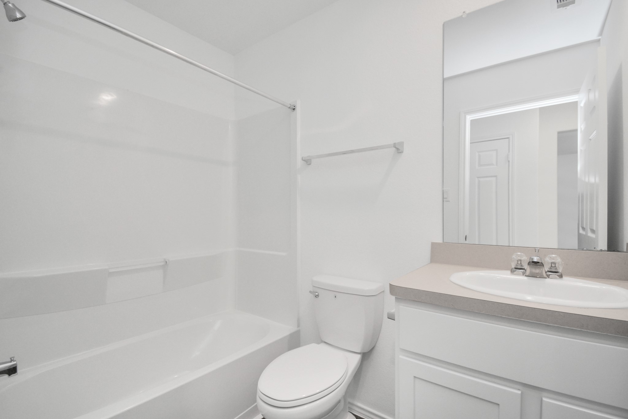 5035 Caledonia Lake Lane Rosharon, TX 77583 - Photo 16 of 37 a bathroom with a sink a toilet and a bathtub